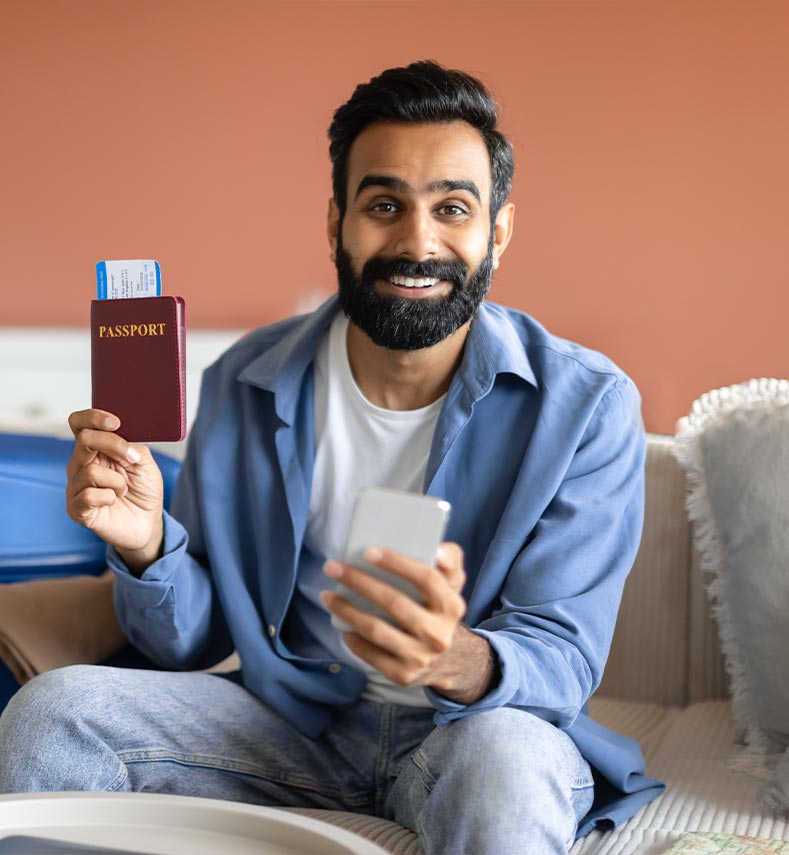 indian-traveler-man-with-phone-showing-boarding-pa-2023-06-20-18-47-20-utc