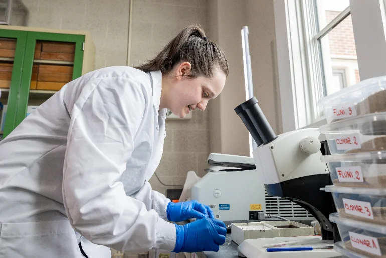 230413-student-working-with-microscope-image